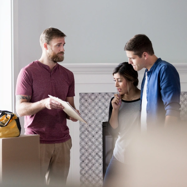 A photograph showing a homeowner discussing roofing options with a contractor.