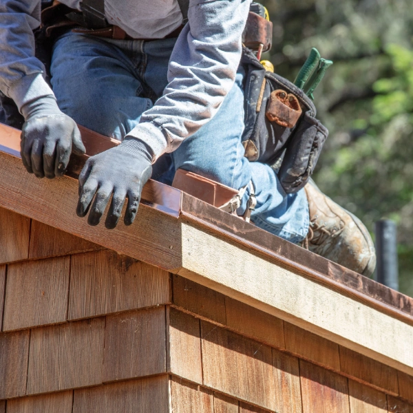 Image showing the installation of flashing around roof penetrations.